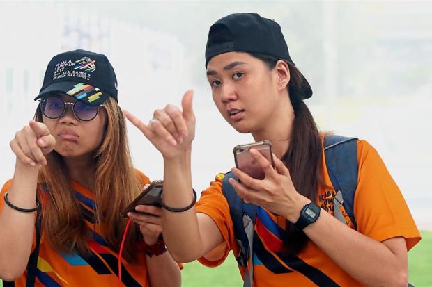 Deafness does not stop duo from volunteering at Games