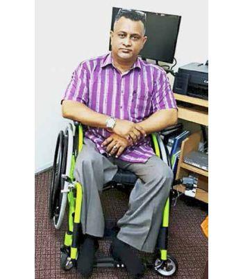 Wheelchair-bound man runs home for disabled kids