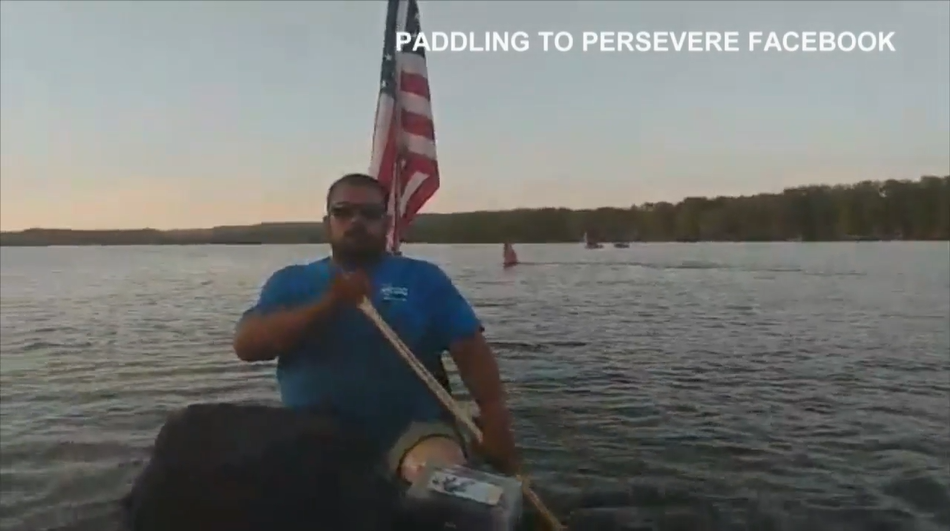 Two men canoe Mississippi River; raise awareness for disabilities