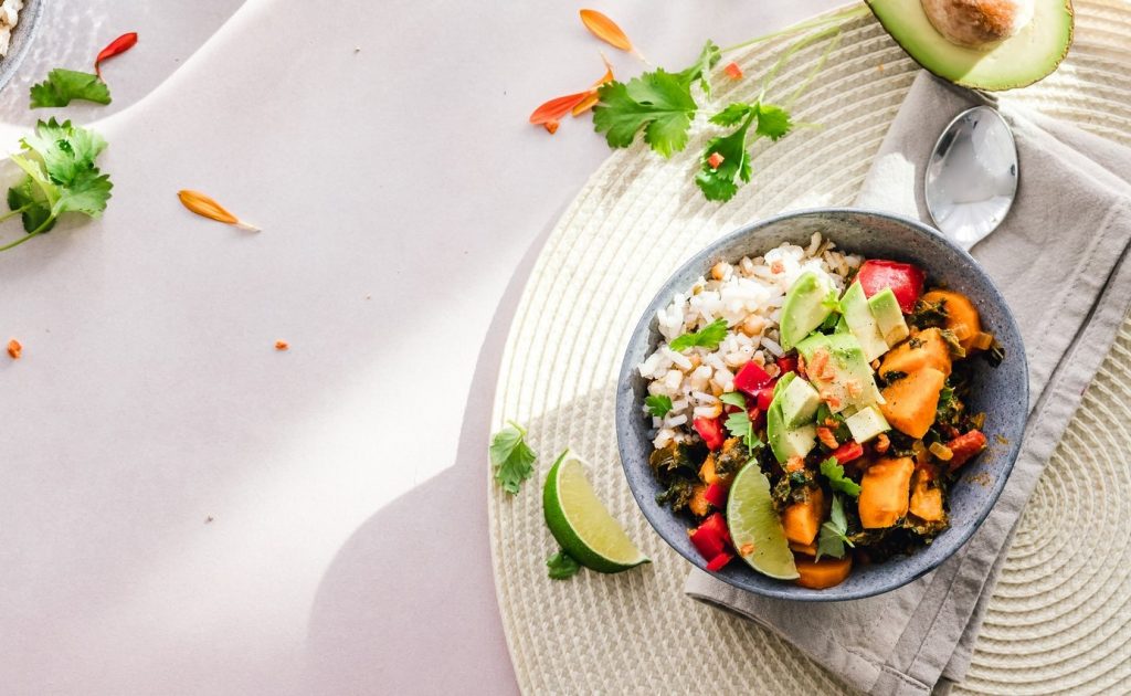 A bowl of mixed grains, fruits and vegetables